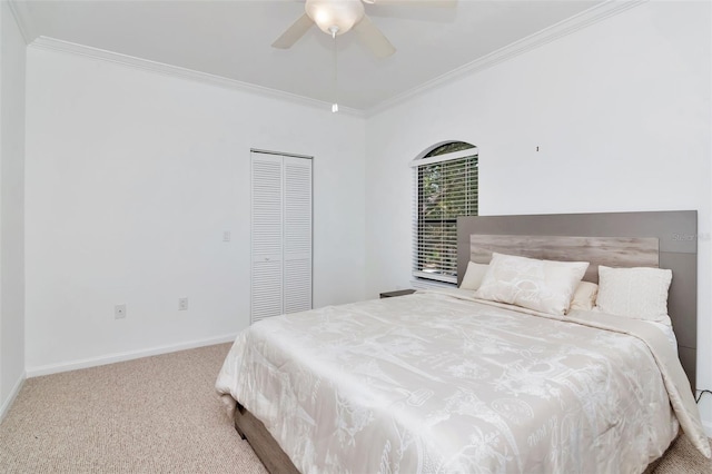 2173 Tuscany Trce Unit 8, Palm Harbor, FL 34683 - carpeted bedroom with ornamental molding, a closet, baseboards, and ceiling fan