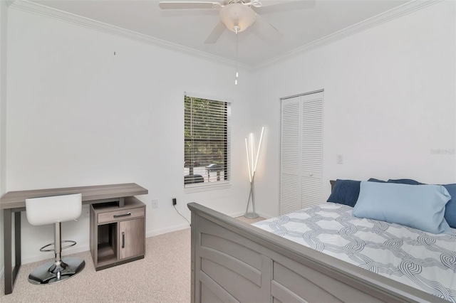 2173 Tuscany Trce Unit 8, Palm Harbor, FL 34683 - bedroom featuring ornamental molding, light carpet, baseboards, a closet, and a ceiling fan