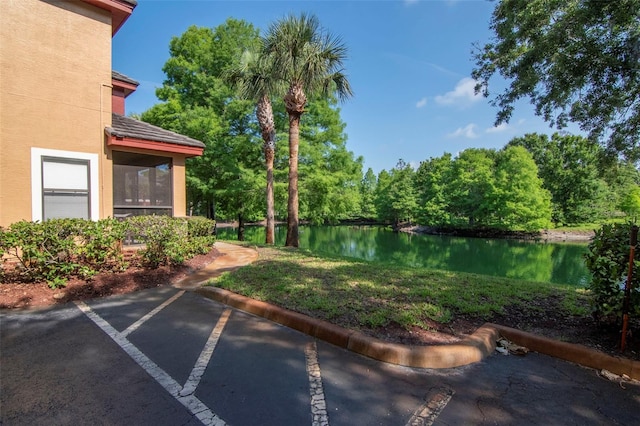 2173 Tuscany Trce Unit 8, Palm Harbor, FL 34683 - view of yard featuring a water view and a sunroom