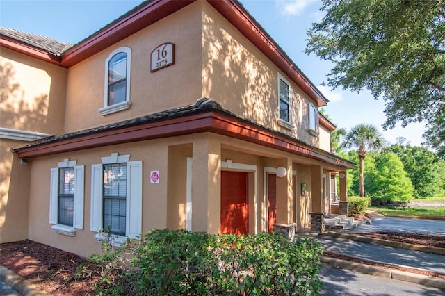 2173 Tuscany Trce Unit 8, Palm Harbor, FL 34683 - view of property exterior featuring stucco siding