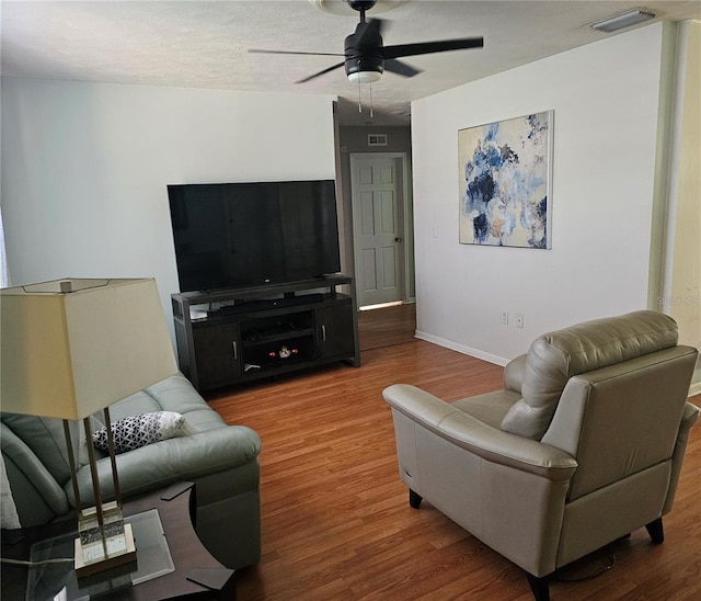 603 Southwood Cv, Brandon, FL 33511 - living area with a ceiling fan, wood finished floors, and baseboards