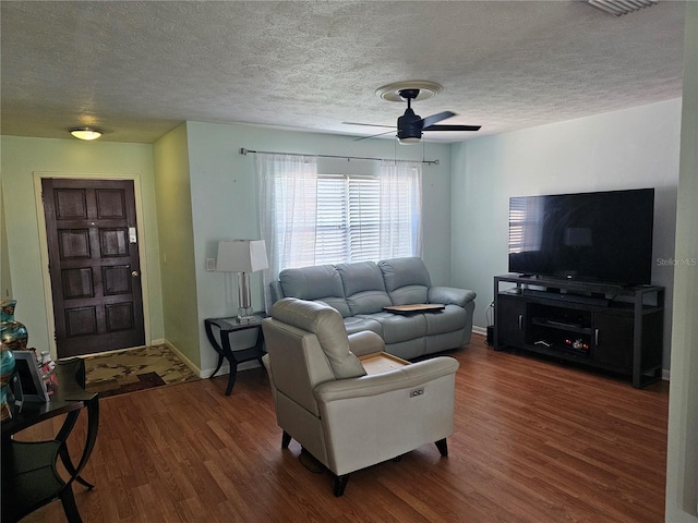 603 Southwood Cv, Brandon, FL 33511 - living area with ceiling fan, wood finished floors, a textured ceiling, and baseboards