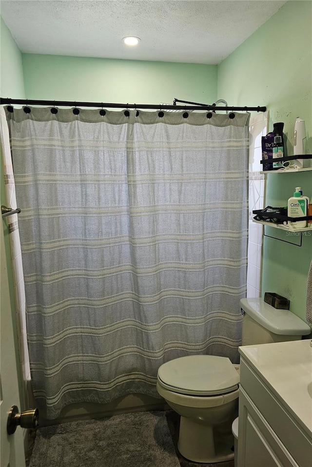 603 Southwood Cv, Brandon, FL 33511 - bathroom with toilet, a textured ceiling, vanity, and a shower with curtain