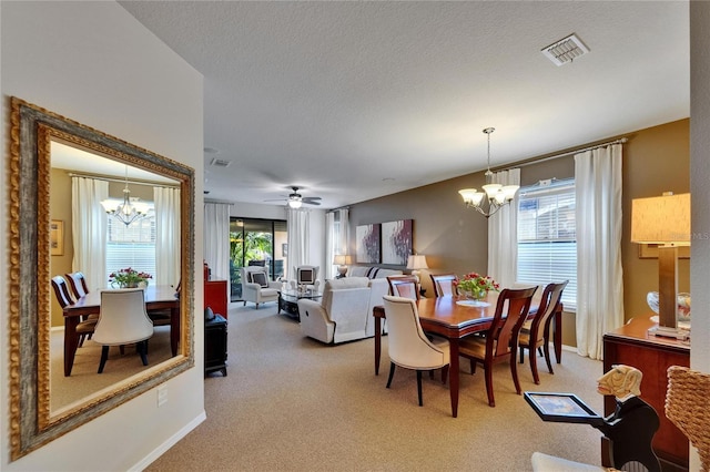 5646 Sunset Falls Dr, Apollo Beach, FL 33572 - dining space with a chandelier, light colored carpet, baseboards, and a textured ceiling