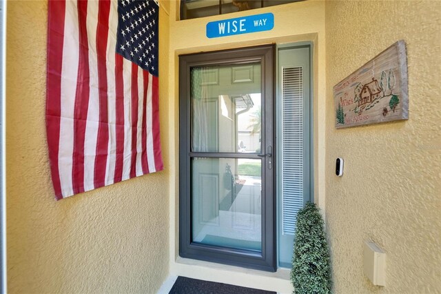 5646 Sunset Falls Dr, Apollo Beach, FL 33572 - property entrance featuring stucco siding