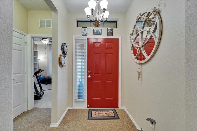 5646 Sunset Falls Dr, Apollo Beach, FL 33572 - carpeted entrance foyer with a chandelier and baseboards