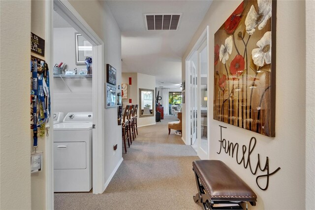 5646 Sunset Falls Dr, Apollo Beach, FL 33572 - corridor with carpet, washing machine and clothes dryer, and baseboards
