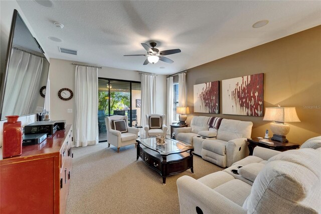 5646 Sunset Falls Dr, Apollo Beach, FL 33572 - living room with ceiling fan and light colored carpet
