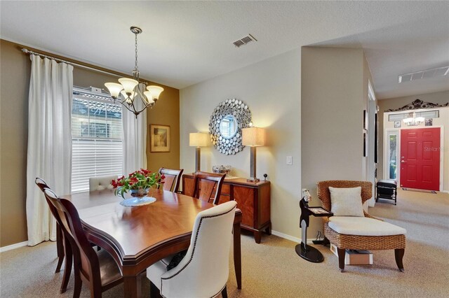 5646 Sunset Falls Dr, Apollo Beach, FL 33572 - dining room with a chandelier, light carpet, and baseboards