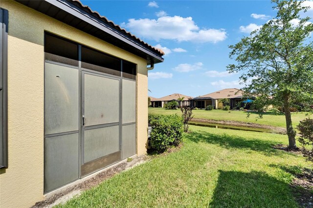 5646 Sunset Falls Dr, Apollo Beach, FL 33572 - view of green lawn featuring a residential view