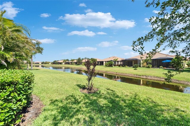 5646 Sunset Falls Dr, Apollo Beach, FL 33572 - view of grassy yard featuring a water view