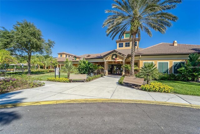 5646 Sunset Falls Dr, Apollo Beach, FL 33572 - view of front of house with a tiled roof and stucco siding