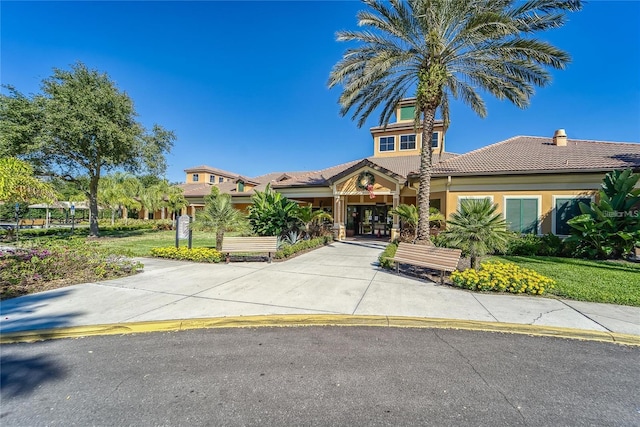 5646 Sunset Falls Dr, Apollo Beach, FL 33572 - view of front facade featuring a tile roof and stucco siding