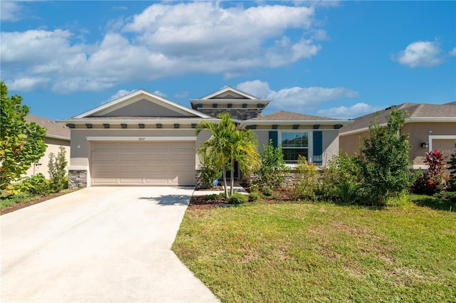 2247 Midnight Pearl Dr, Sarasota, FL 34240 - view of front of home with stucco siding, driveway, a garage, and a front yard