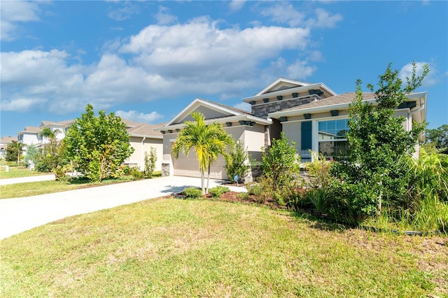 2247 Midnight Pearl Dr, Sarasota, FL 34240 - view of front of home featuring concrete driveway, a garage, stucco siding, and a front lawn
