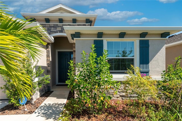2247 Midnight Pearl Dr, Sarasota, FL 34240 - property entrance with stone siding and stucco siding