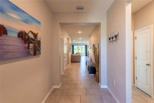 2247 Midnight Pearl Dr, Sarasota, FL 34240 - corridor with light tile patterned floors, baseboards, and recessed lighting