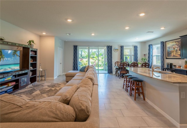 2247 Midnight Pearl Dr, Sarasota, FL 34240 - living area with recessed lighting, baseboards, and light tile patterned floors