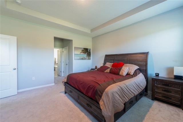 2247 Midnight Pearl Dr, Sarasota, FL 34240 - bedroom with carpet flooring, a tray ceiling, baseboards, and ensuite bathroom