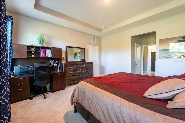 2247 Midnight Pearl Dr, Sarasota, FL 34240 - bedroom with light carpet, a tray ceiling, and a desk