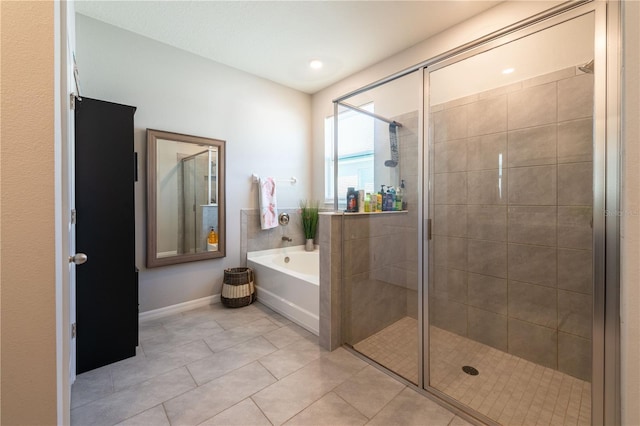 2247 Midnight Pearl Dr, Sarasota, FL 34240 - full bathroom featuring a bath, a stall shower, tile patterned flooring, and baseboards