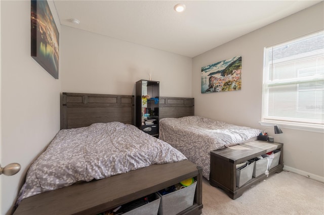 2247 Midnight Pearl Dr, Sarasota, FL 34240 - bedroom featuring light carpet and baseboards