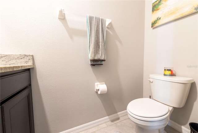 2247 Midnight Pearl Dr, Sarasota, FL 34240 - half bath featuring baseboards, vanity, toilet, and tile patterned flooring