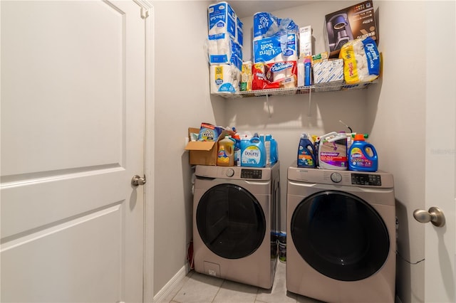 2247 Midnight Pearl Dr, Sarasota, FL 34240 - laundry room featuring separate washer and dryer, light tile patterned flooring, and baseboards