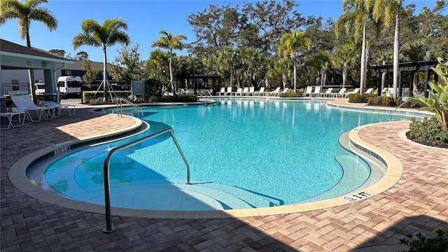 2247 Midnight Pearl Dr, Sarasota, FL 34240 - community pool with a patio