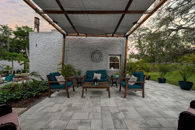 6251 4th Ave S, Saint Petersburg, FL 33707 - patio terrace at dusk with a pergola, a patio, and outdoor lounge area