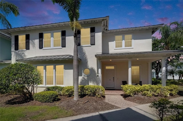 110 Aberdeen Pond Dr, Apollo Beach, FL 33572 - view of front of property with stucco siding, a standing seam roof, and metal roof