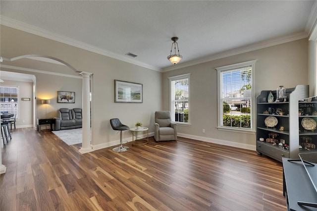 110 Aberdeen Pond Dr, Apollo Beach, FL 33572 - sitting room with decorative columns, arched walkways, wood finished floors, crown molding, and baseboards