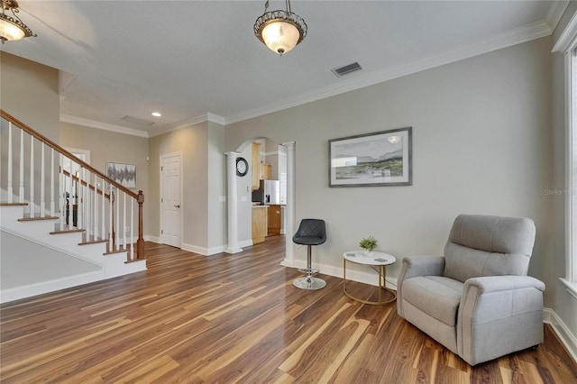110 Aberdeen Pond Dr, Apollo Beach, FL 33572 - living area with wood finished floors, baseboards, recessed lighting, stairway, and arched walkways