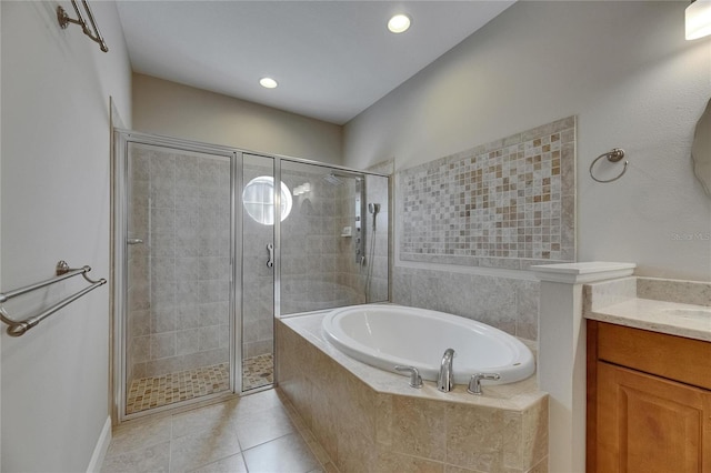 110 Aberdeen Pond Dr, Apollo Beach, FL 33572 - bathroom featuring a garden tub, a shower stall, vanity, tile patterned flooring, and recessed lighting