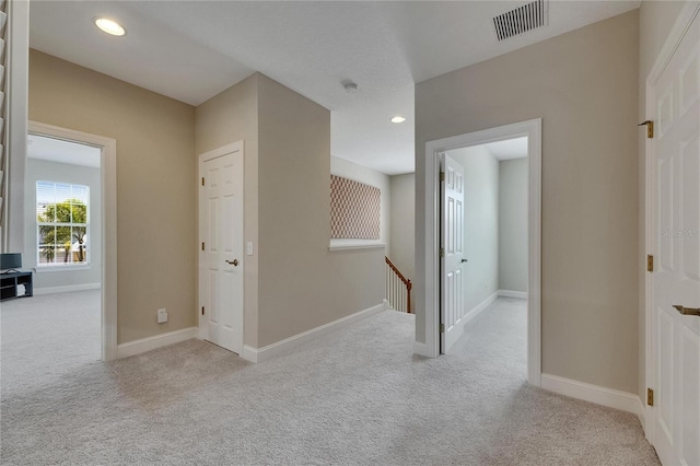 110 Aberdeen Pond Dr, Apollo Beach, FL 33572 - hall featuring an upstairs landing, carpet, baseboards, and recessed lighting