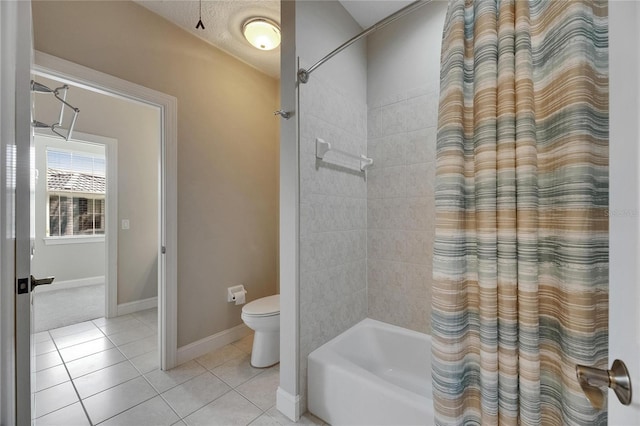 110 Aberdeen Pond Dr, Apollo Beach, FL 33572 - full bathroom with tile patterned flooring, shower / bath combo with shower curtain, toilet, and baseboards