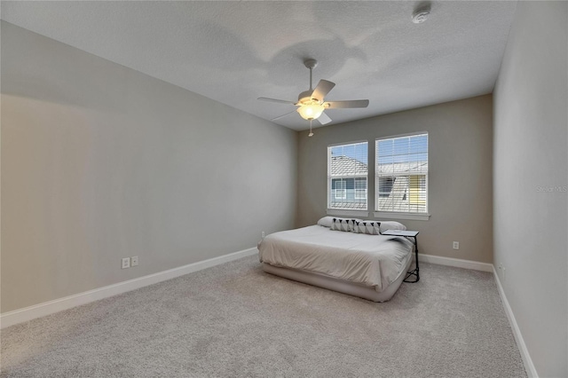 110 Aberdeen Pond Dr, Apollo Beach, FL 33572 - carpeted bedroom with baseboards, a textured ceiling, and ceiling fan