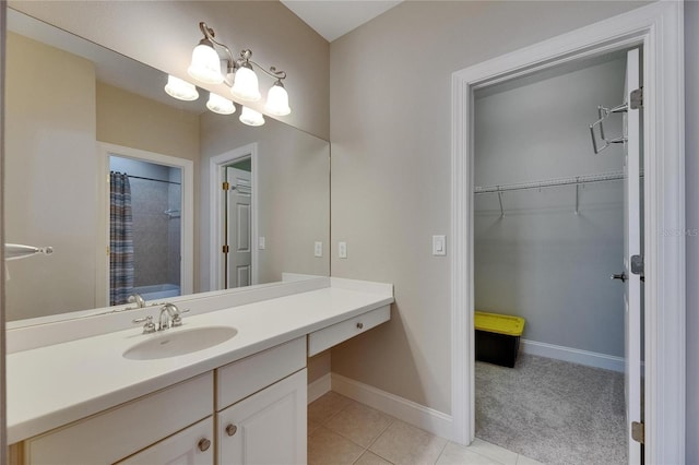 110 Aberdeen Pond Dr, Apollo Beach, FL 33572 - full bathroom featuring vanity, tile patterned flooring, a shower with curtain, baseboards, and a spacious closet