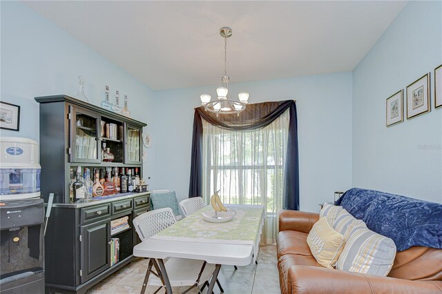 2723 Garden Falls Dr, Brandon, FL 33511 - dining room featuring a chandelier and light tile patterned floors