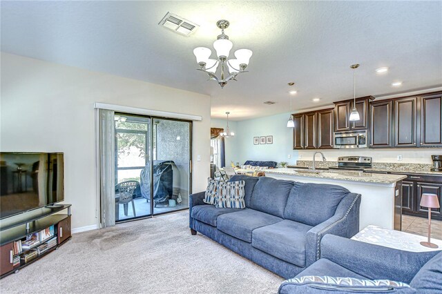 2723 Garden Falls Dr, Brandon, FL 33511 - living room with a chandelier, light carpet, recessed lighting, and baseboards