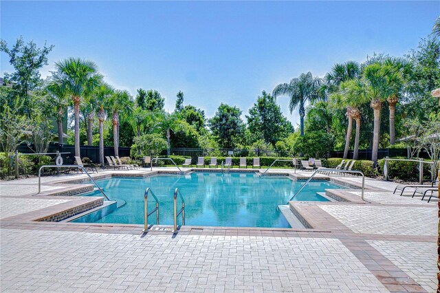 2723 Garden Falls Dr, Brandon, FL 33511 - community pool with a patio and view of wooded area