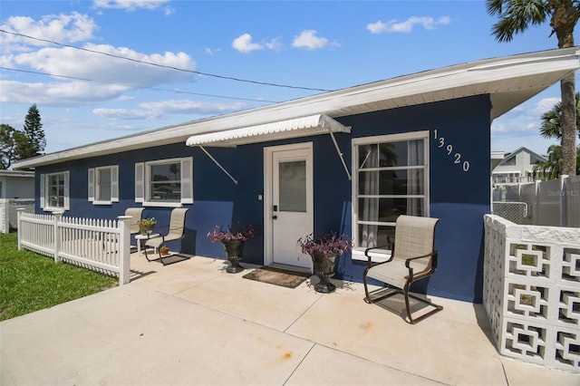 13920 Berkowitz Ave, Hudson, FL 34667 - rear view of property featuring a patio and stucco siding