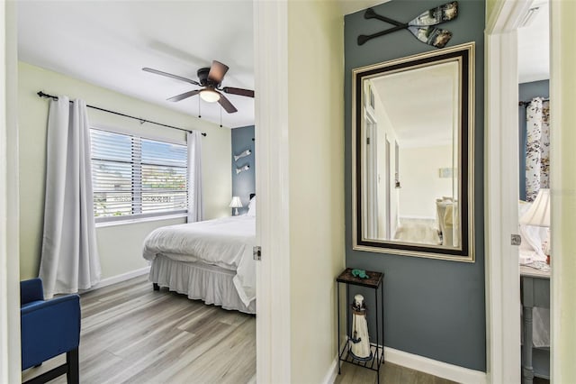 13920 Berkowitz Ave, Hudson, FL 34667 - bedroom featuring wood finished floors, baseboards, and ceiling fan