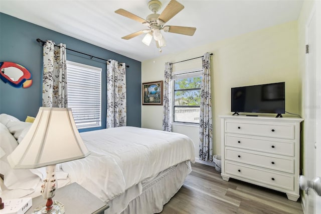 13920 Berkowitz Ave, Hudson, FL 34667 - bedroom featuring wood finished floors and ceiling fan