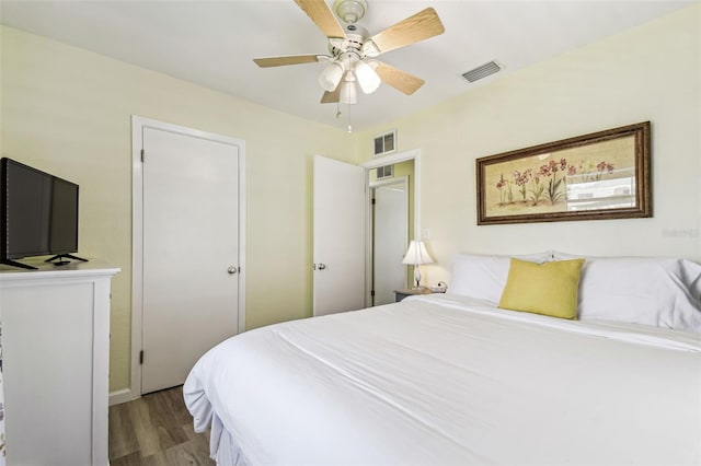 13920 Berkowitz Ave, Hudson, FL 34667 - bedroom featuring wood finished floors, a ceiling fan, and baseboards