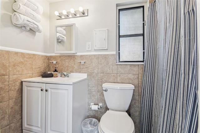 13920 Berkowitz Ave, Hudson, FL 34667 - bathroom featuring tile walls, toilet, vanity, and curtained shower