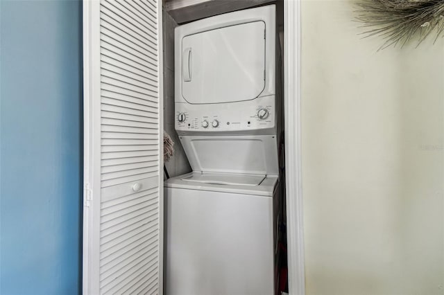 13920 Berkowitz Ave, Hudson, FL 34667 - washroom featuring stacked washer / dryer