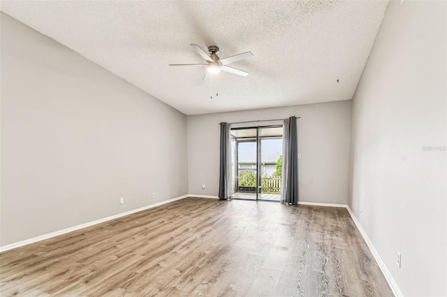 39650 US Highway 19 N Unit 143, Tarpon Springs, FL 34689 - empty room featuring a textured ceiling, ceiling fan, light wood-style flooring, and baseboards