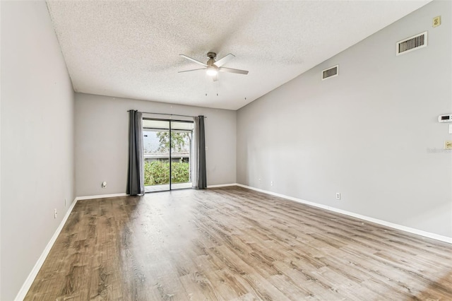 39650 US Highway 19 N Unit 143, Tarpon Springs, FL 34689 - empty room featuring a ceiling fan, wood finished floors, a textured ceiling, and baseboards