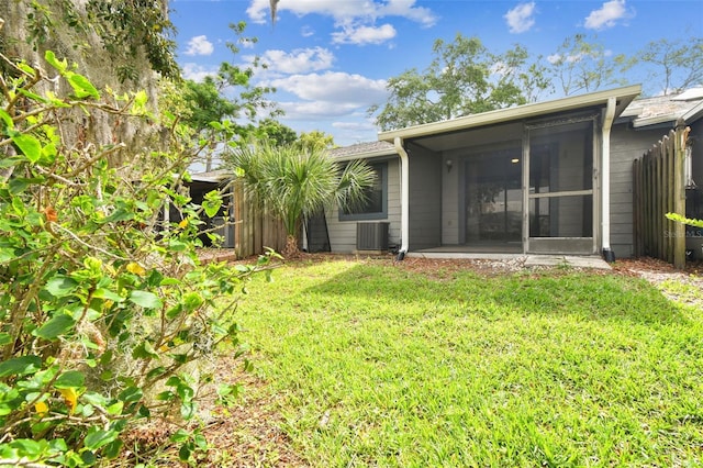 39650 US Highway 19 N Unit 143, Tarpon Springs, FL 34689 - back of property with a sunroom and central AC unit